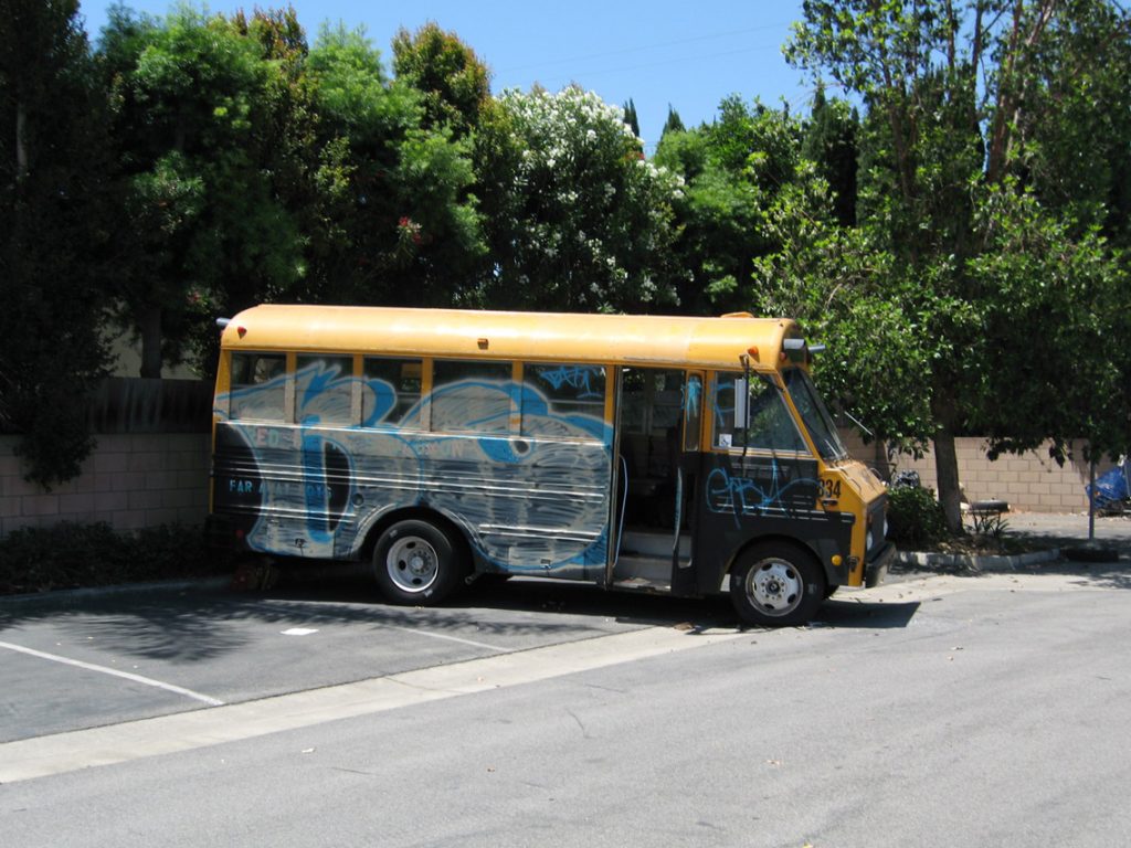 Premises trespasser liability — church van parked in a shaded lot, an example of property requiring reasonable safety upkeep